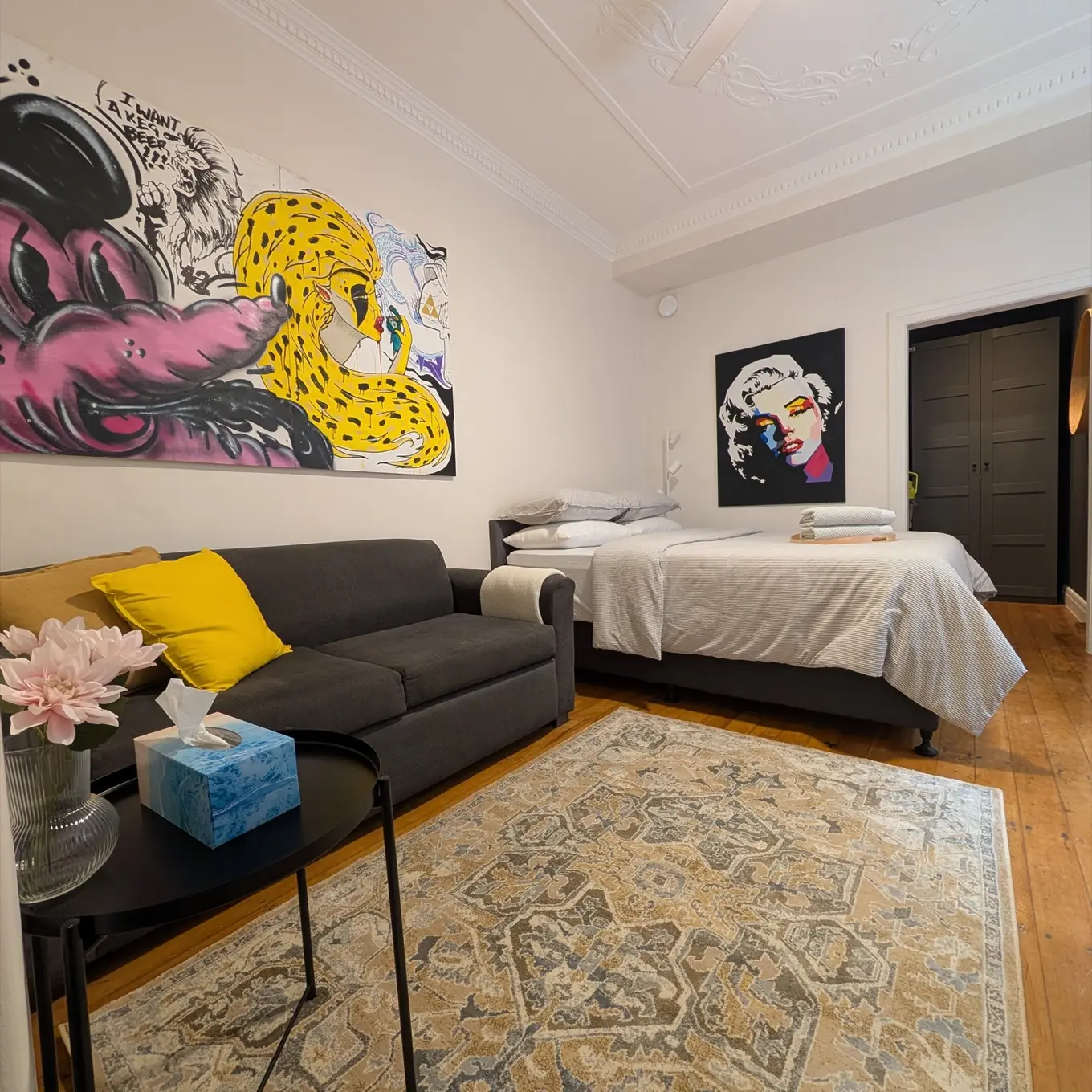Living space and queen bed at Laneway Studio, Surry Hills