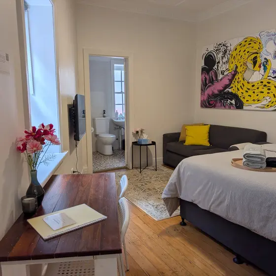 Dining table and TV in Laneway Studio, Surry Hills